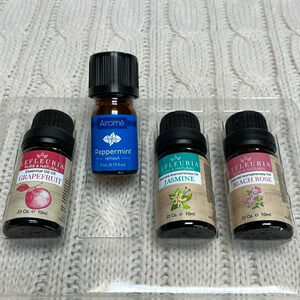 NWOT Essential Oils. Lot of 4. Scents: grapefruit, peppermint, jasmine, rose